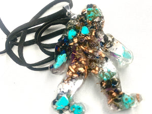 hand made orgone bigfoot pendant with quartz crystals and turquoise