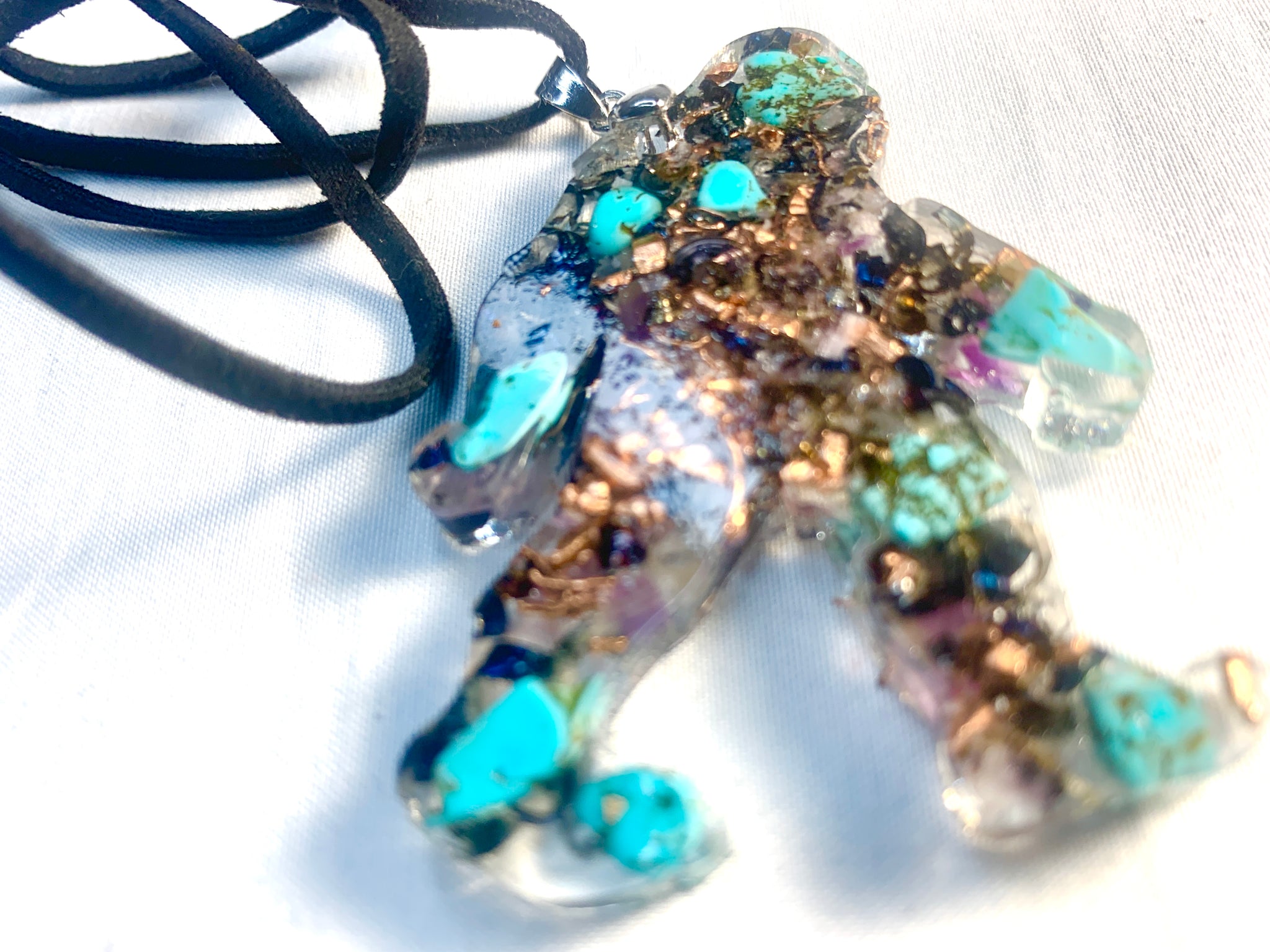 hand made orgone bigfoot pendant with quartz crystals and turquoise