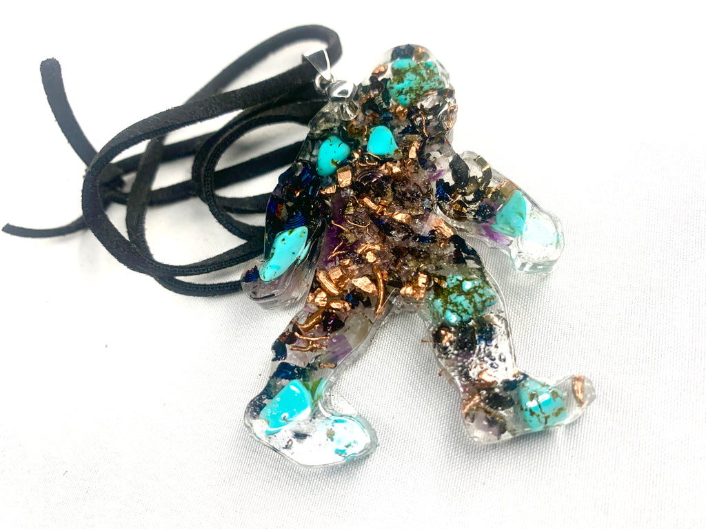 hand made orgone bigfoot pendant with quartz crystals and turquoise